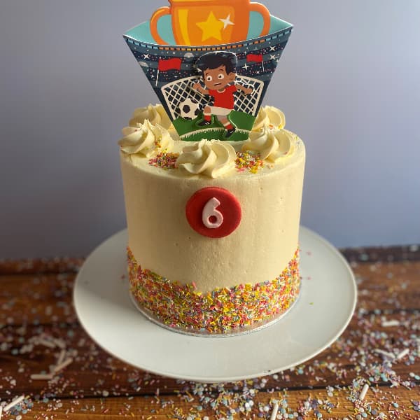 Tall Tier Buttercream Soccer Cake with soccer Topper and Sprinkles